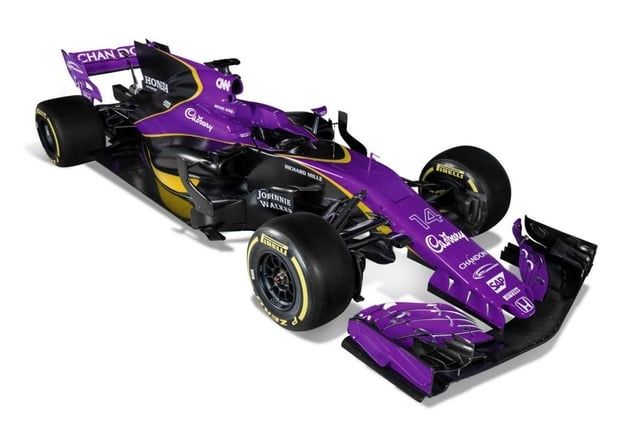 A formula one car with a purple, yellow and black livery based on Cadbury chocolate colours