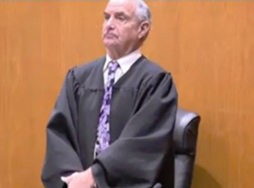 Justice Michael B. Aloise wearing purple as he presides over the trial of Chanel Lewis for the murder of Karina Vetrano in Queens, NYC.