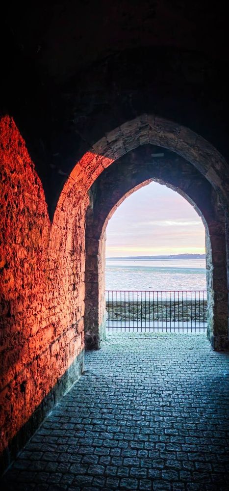 Porth yr Aur in Caernarfon tonight. Porth yr Aur translates to Golden Gate and is part of the old town walls of Caernarfon. The picture looks towards the afon fenai with a beautiful sunset