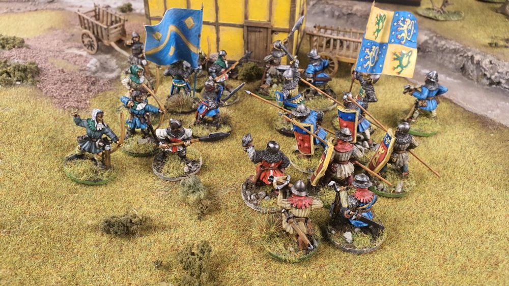 28mm French face off against English in front of  half-timbered house.