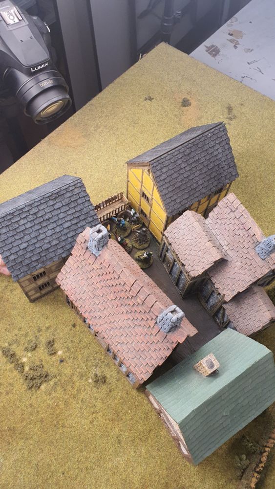 A group of 28mm medieval houses - staging for a photo shoot for the new rules.