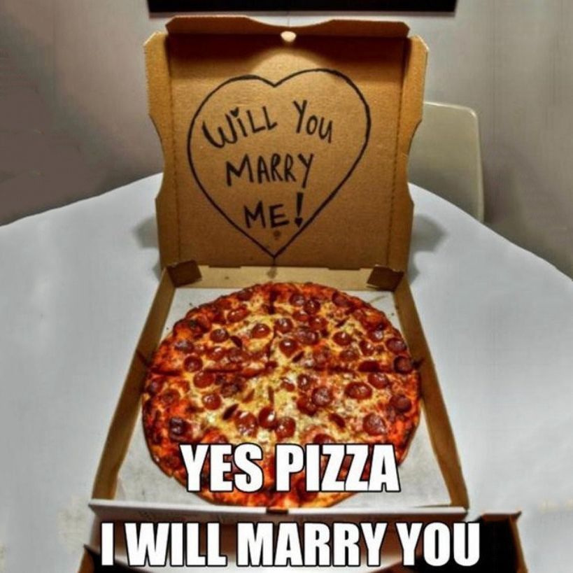 Open pizza box with “will you marry me?” Drawn In a heart on the inside cover and the text YES PIZZA I WILL MARRY YOU 