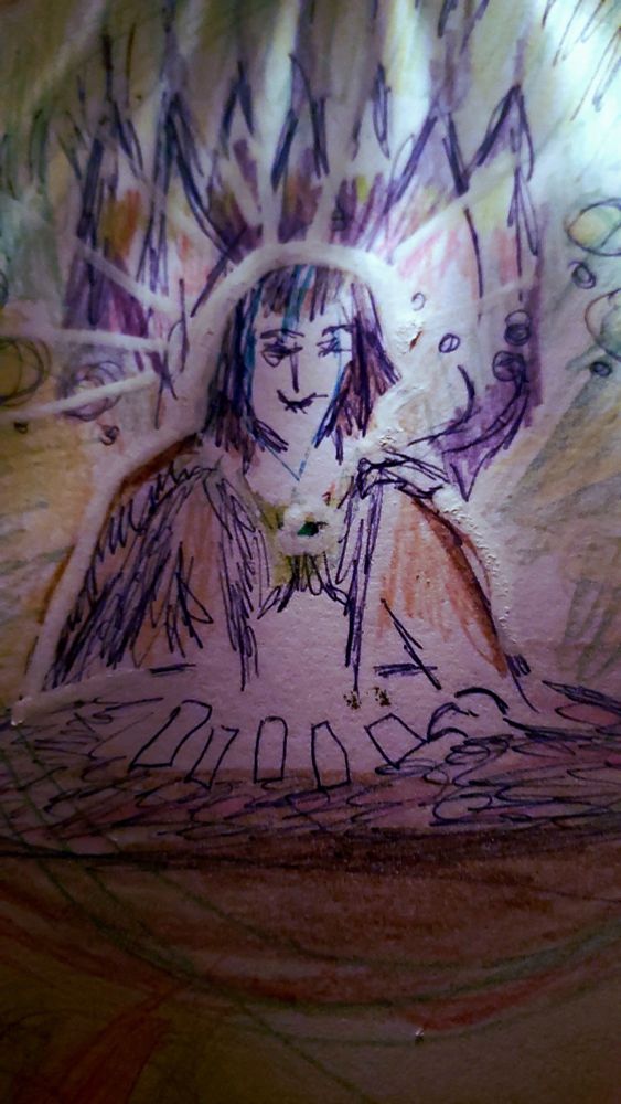 Dim drawing of female reading tarot cards with cosmic beings in the background. 