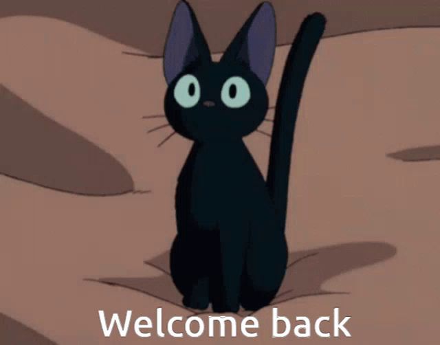 a black cat is standing in front of a welcome back message