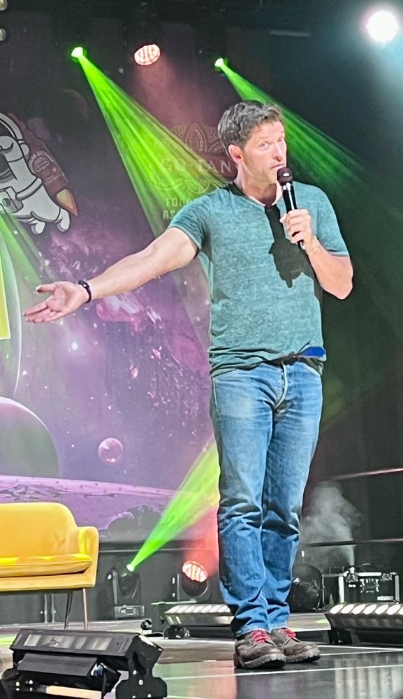 Misha Collins on stage at Heroes Dutch Comic Con, pointing right