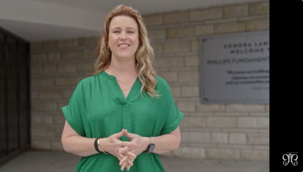 Teacher-Presenter standing ready to speak. 