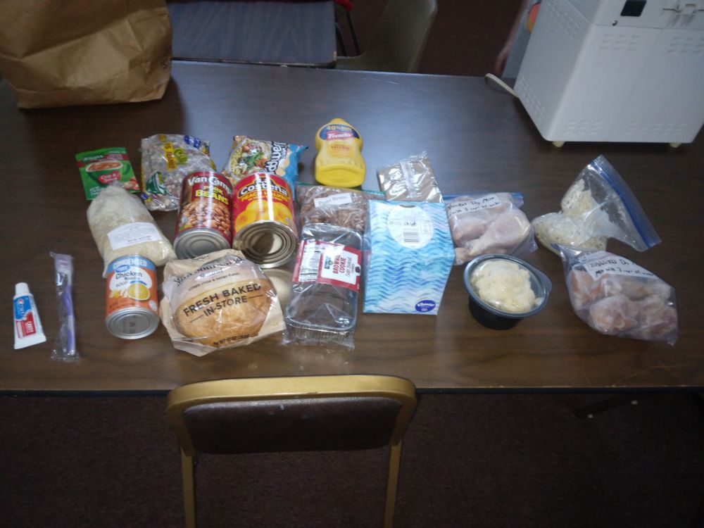 One can of soup, one packet of instant soup, one can of beans, one can of fruit, bread, a bag of beans, a bag of noodles, and a bag of rice pilaf.  Also a toothbrush and toothpaste (sample size)