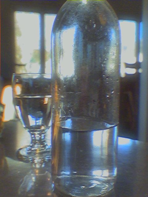 Photograph of two glasses of water taken with the 0.3mp Camera app on an iPhone 15