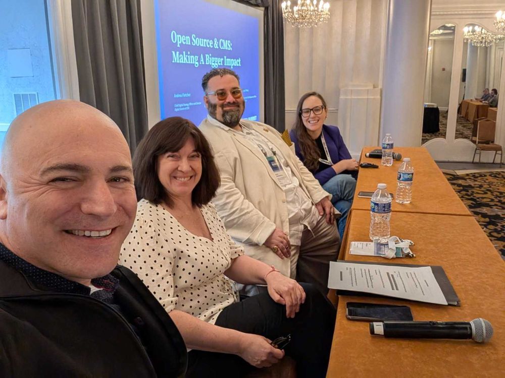 Aaron Pava with Andrea Fletcher, Jennifer Belman, and Remy DeCausemaker, seated for their panel at the code for america summit 