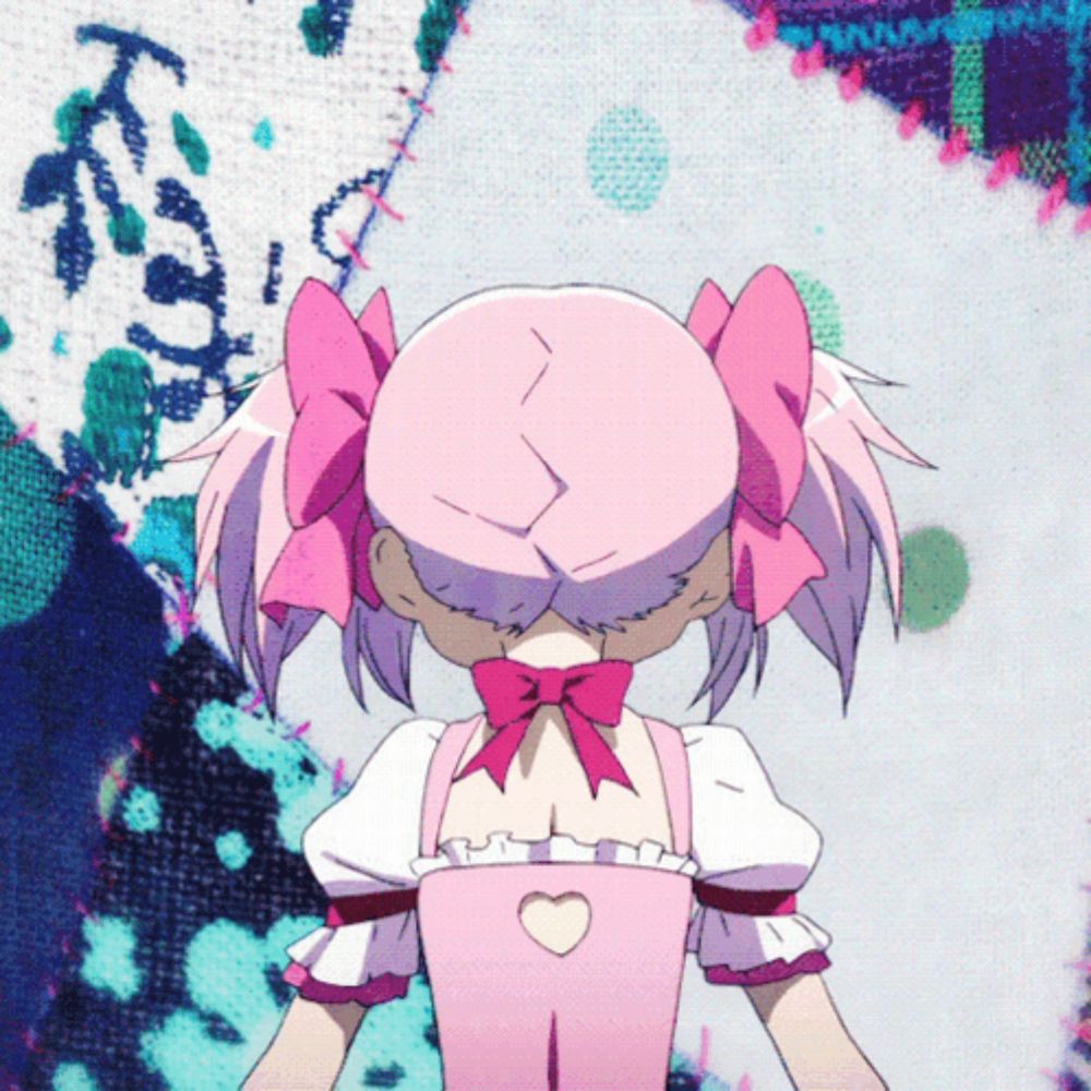 a girl with pink hair and a bow on her back