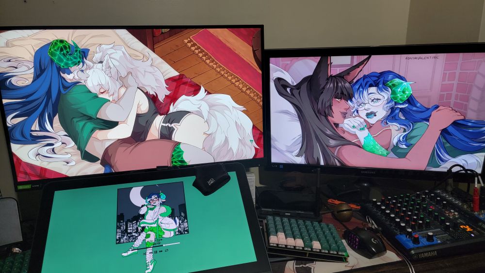 Photo of my computer monitor set up, showing three monitors. Their wallpapers are art I've commissioned from @ronyavalentine.bsky.social and @superreflex.bsky.social