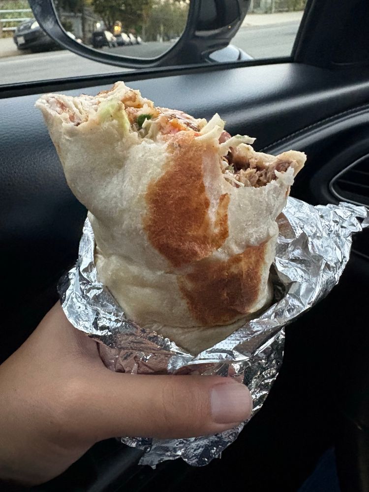Half eaten burrito from De La Hacienda Taqueria, Santa Cruz 