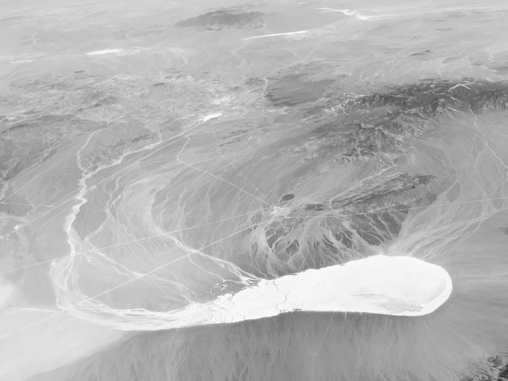black and white photo of a salt flat in Nevada taken from a plane