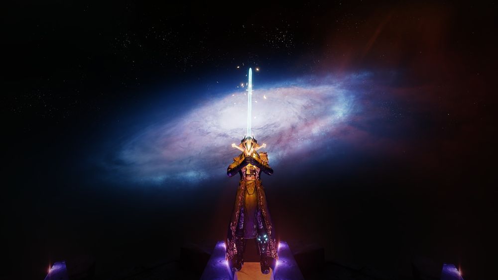 The video game Destiny 2 by Bungie. A warlock standing, holding up a large gold and blue sword, a galaxy swirls in the background, against the dark expanse of space.
