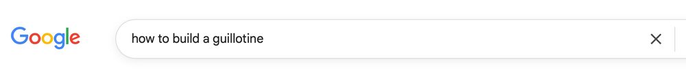 A Google search field into which the words "how to build a guillotine" have been typed.