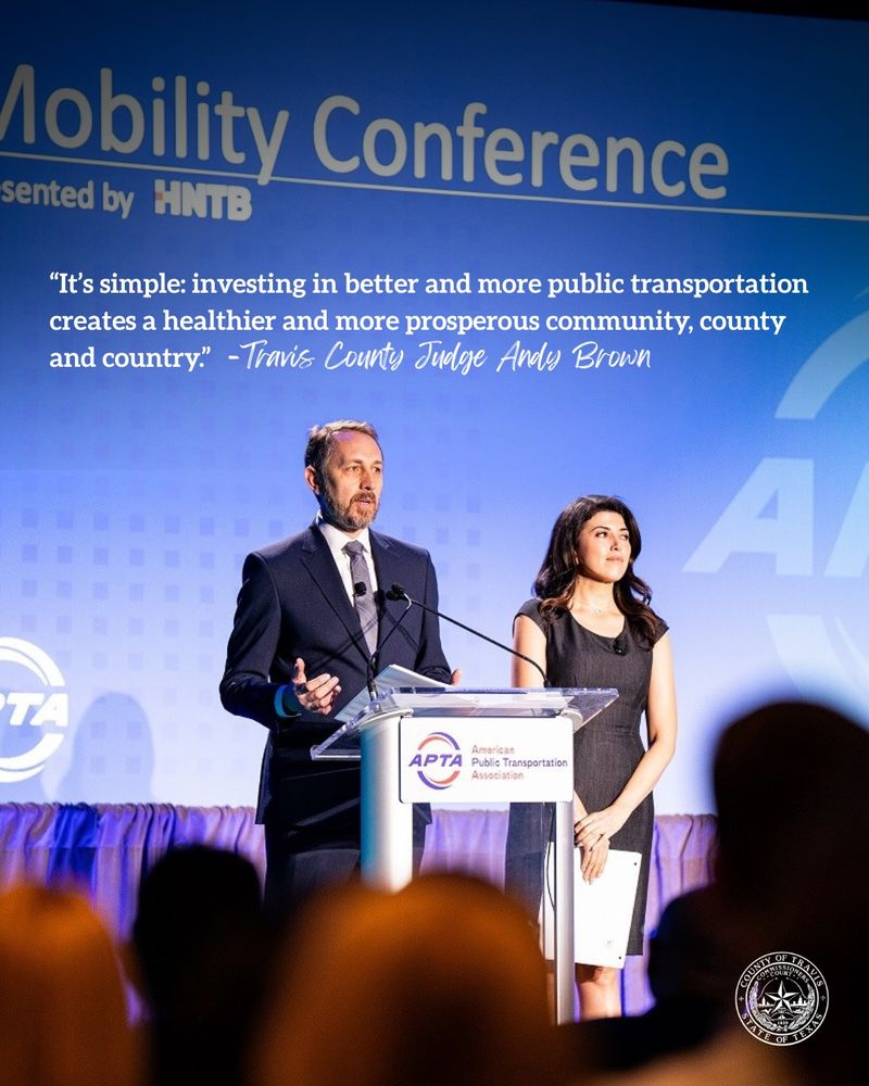 picture of Judge Brown speaking at a conference with a quote that reads: “It’s simple: investing in better and more public transportation creates a healthier and more prosperous community, county and country.” -Travis County Judge Andy Brown