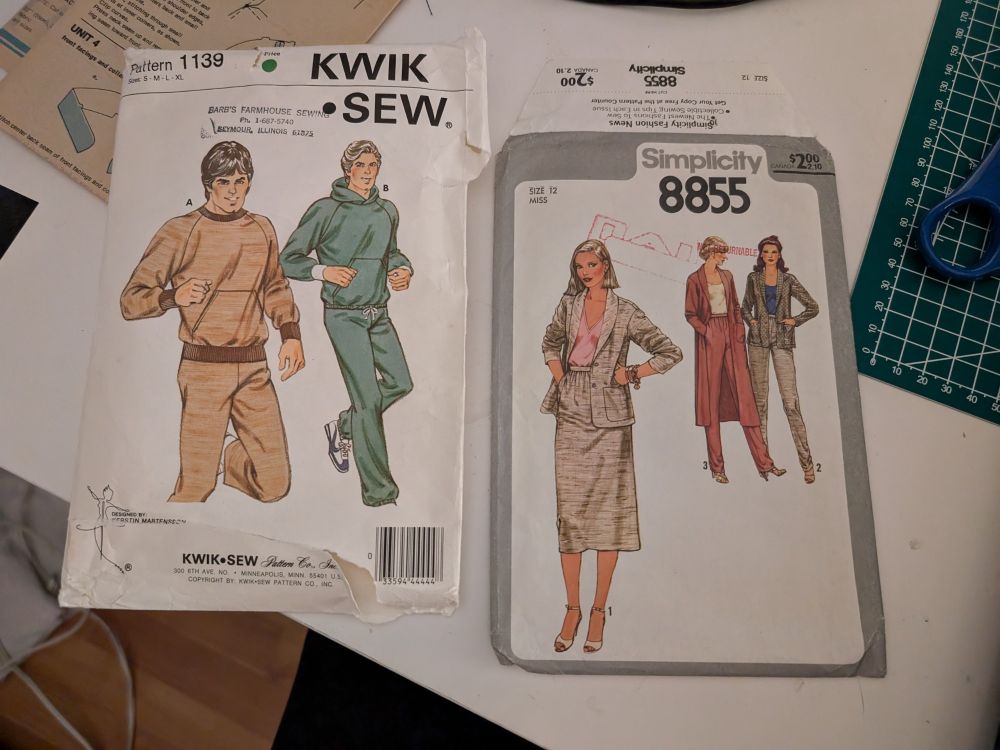 Two very old (70s/80s) sewing patterns. One is for sweaters, hoodies, and joggers. The other is for skirts, pants, and cardigans.