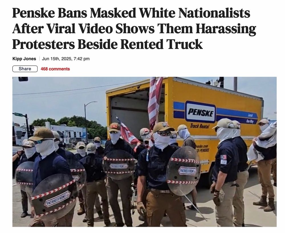 A bunch of racist dipshits dressed up in battle gear, wearing masks, standing outside a fucking Penske truck, looking like utter losers.