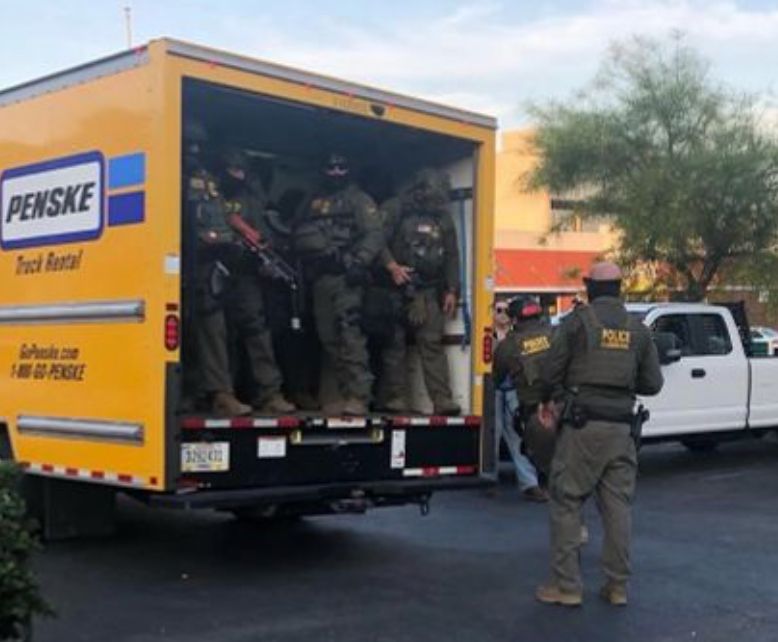 A bunch of racist dipshits dressed up in battle gear, wearing masks, standing outside a fucking Penske truck, looking like utter losers, but this time they're ICE