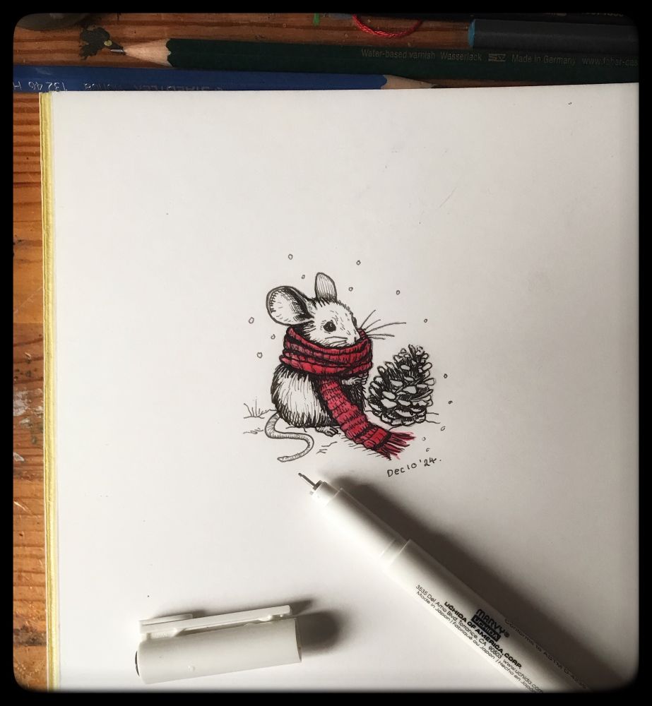 A pen drawing of a mouse wearing a red scarf. He sits near a pine cone.