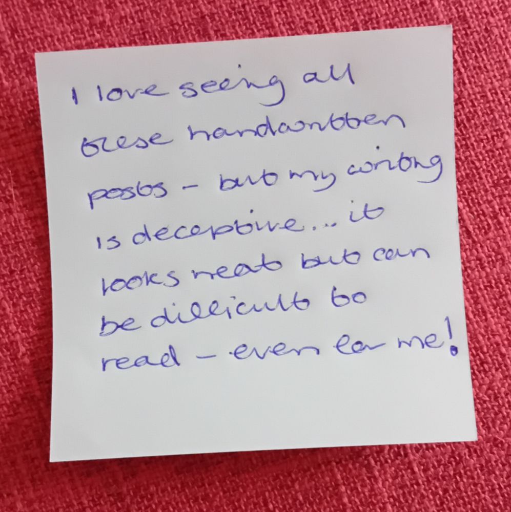 Handwritten note, in blue bic pen on a small square of paper. 

Google lens thought I said: I love seing all Grese handantben posos but my corong is deceptive... it looks neat but can be dillicult to read even la me!

I actually wrote: I love seeing all these handwritten posts - but my writing is deceptive... it looks neat but can be difficult to read - even for me!