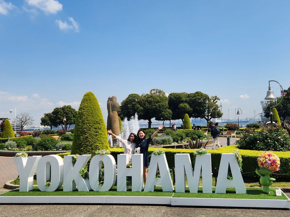 Indu and Sunnie in front of the Yokohama city name sculpture