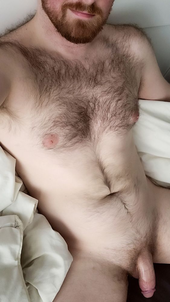 Naked hairy person with a soft cock