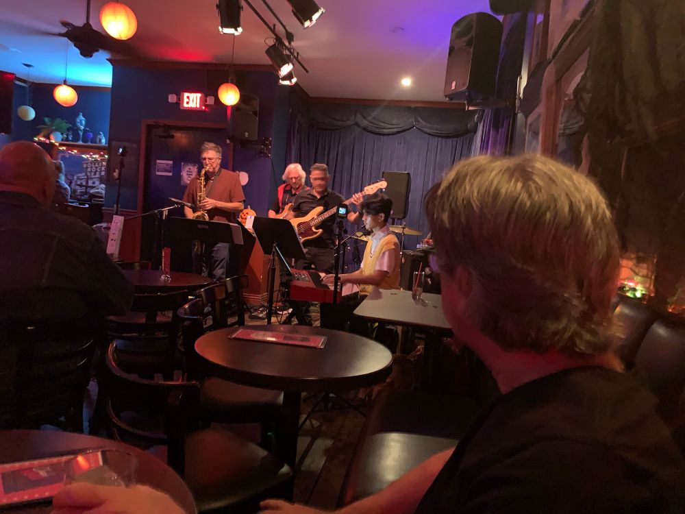 A jazz band plays in a bar. 
