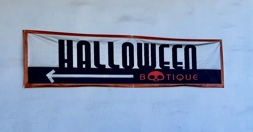 A sign reading Halloween Bootique, a Halloween store