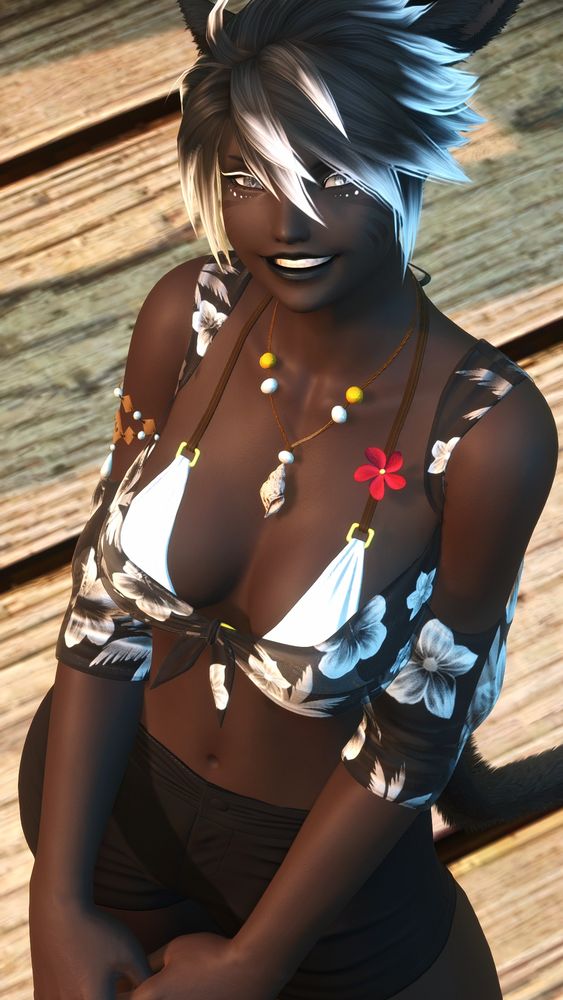 A portrait view of Domino, angled downward. She is looking up at the camera with a large grin on her face.
