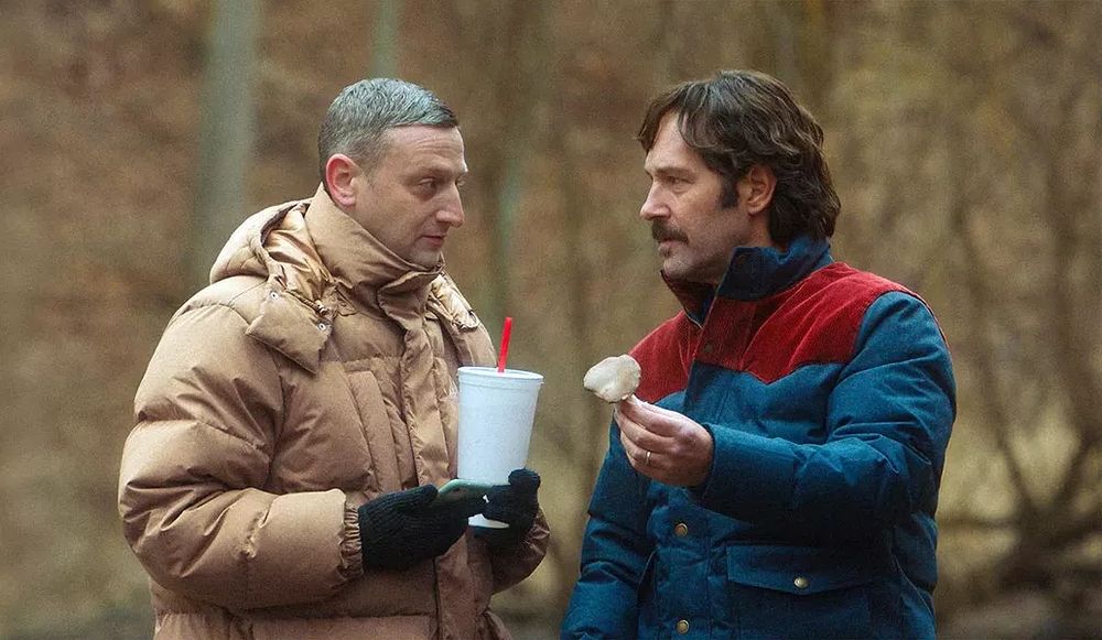 Screenshot from Friendship.

Craig (Tim Robinson, left) and Austin (Paul Rudd, right) chat in a forest, while Austin shows him a mushroom he plucked from the ground.