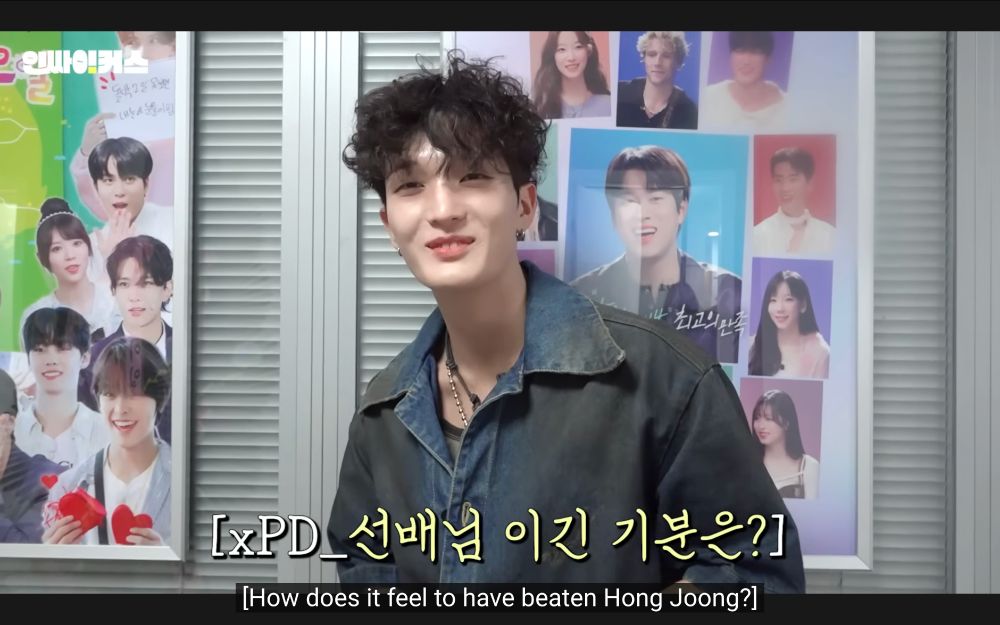 director asking xiker's baby "how does it feel to have beaten hong joong?"