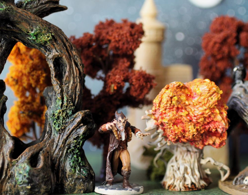 Tabletop miniatures of a Nosferatu looking just exactly like Count Chocula, wandering through some autumn woods.
