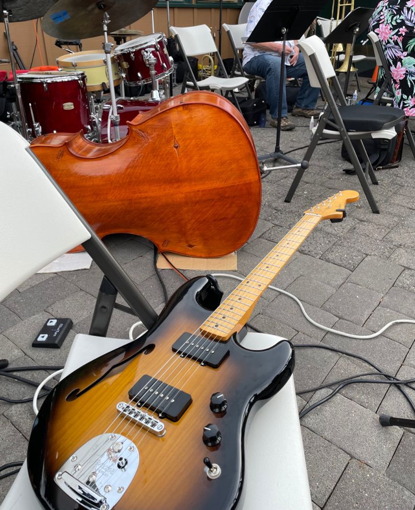 Guitar and other instruments on stage at a jazz gig