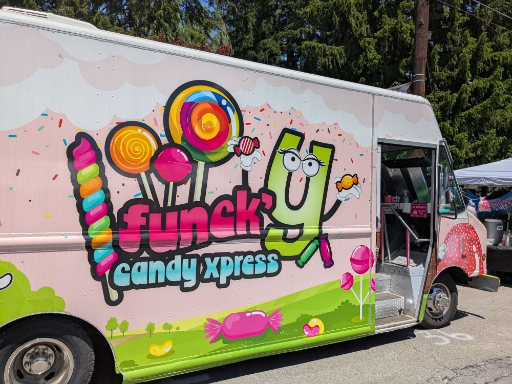 The side of the truck. A colorful sign says "Funck'y Candy Xpress".