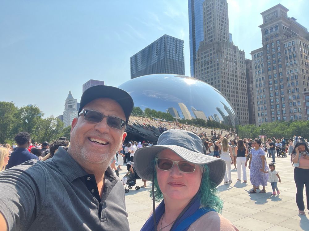 Commenter and her husband in front of the Cloud Gate sculpture in Chicago, a.k.a. “the bean.”