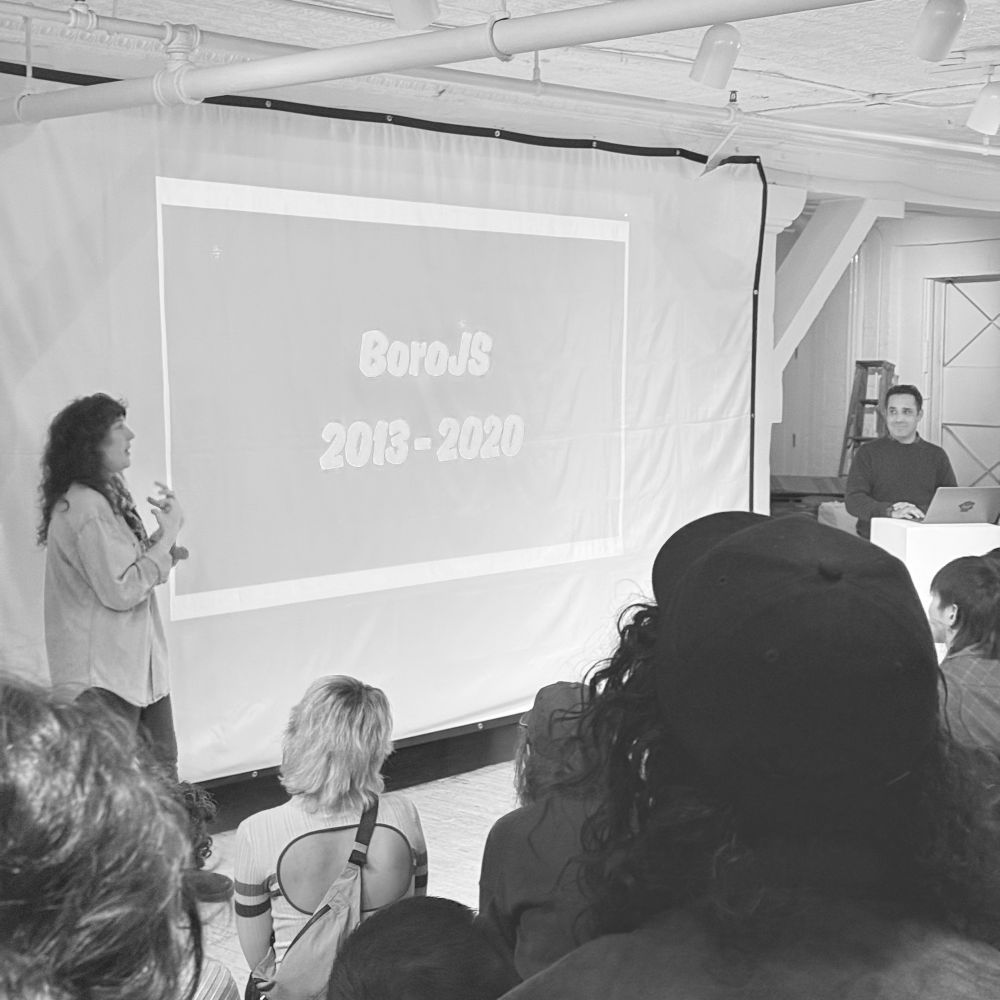 Projector screen with two presenters. The slide says “BoroJS, 2013-2020”