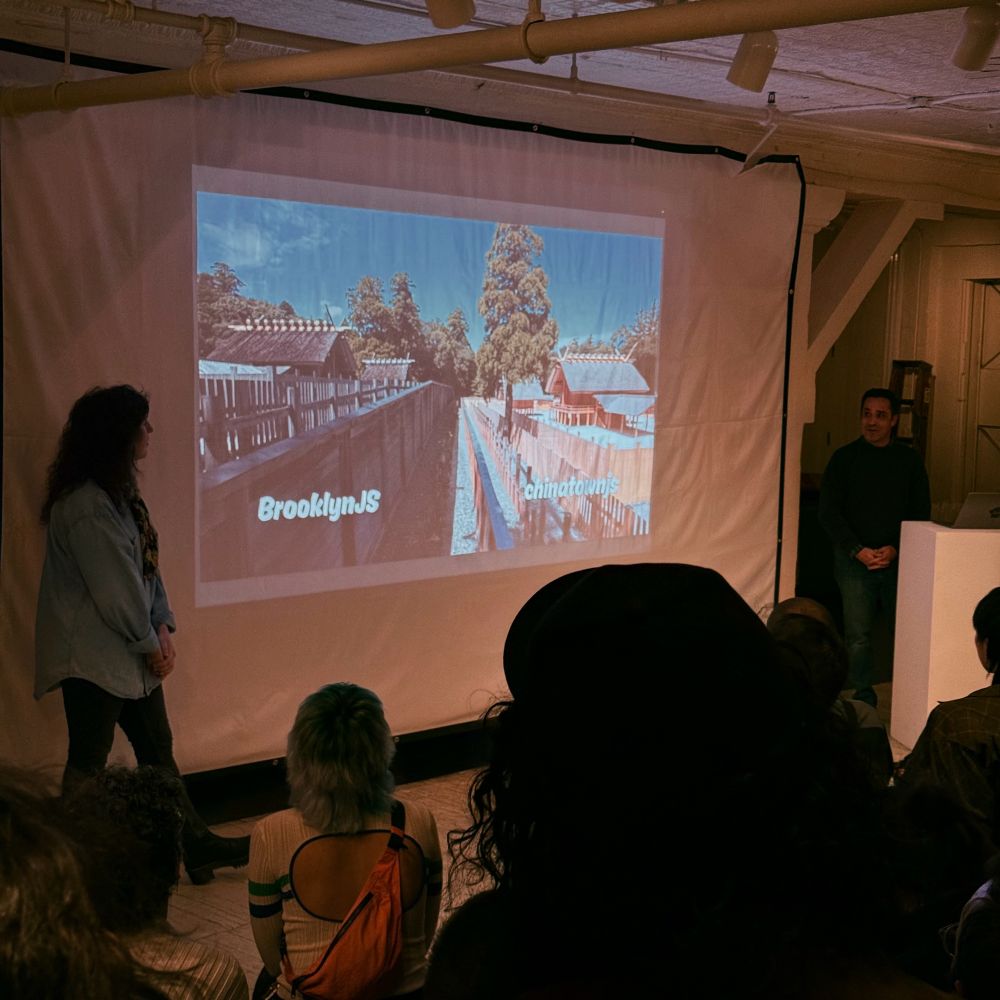 Projector screen showing a slide featuring a Shinto temple, the left side clearly older labeled BrooklynJS, and the right side clearly newer labeled chinatownjs