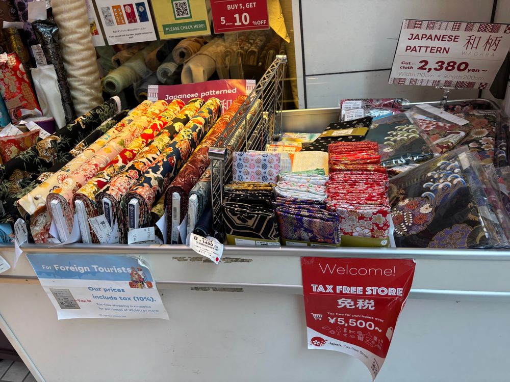 Rolls of fabrics & also cut squares of kimono fabric. 