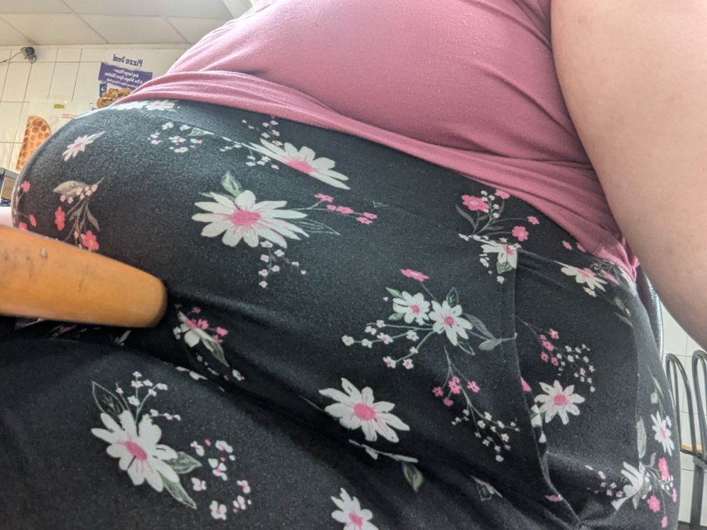 The same fat woman, her belly still being dug into my the table but from a lower angle giving more of a side profile 