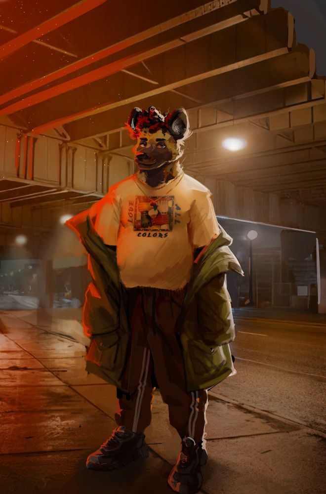 Darius standing underneath an underpass at night. Wearing fashionable clothes.
