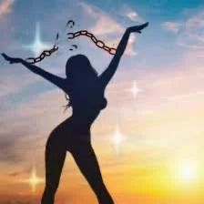Woman joyfully breaks the chains around her hands 