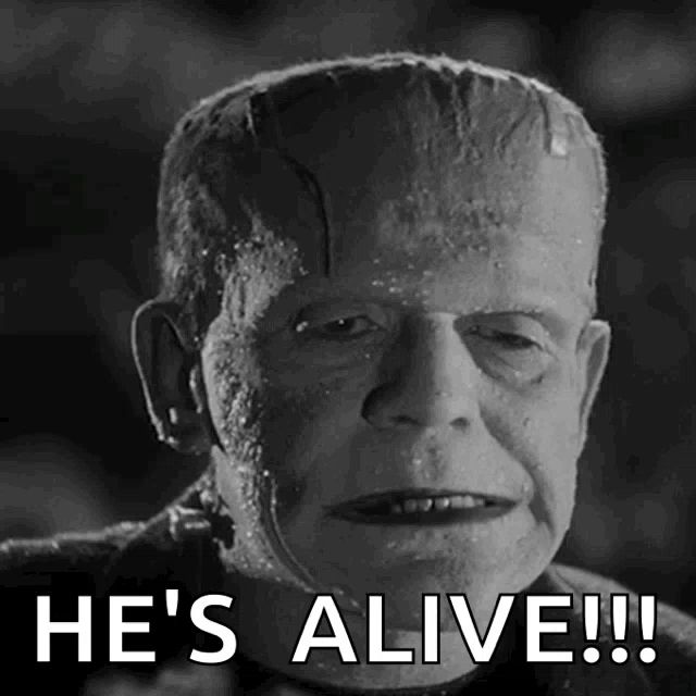 a black and white photo of frankenstein with the caption he 's alive !!