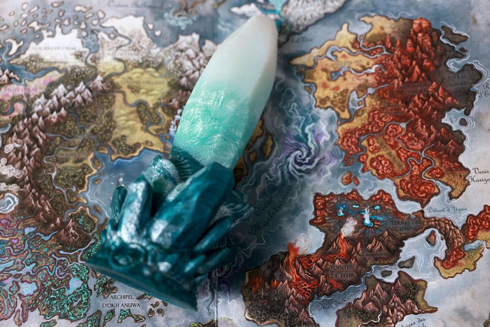 Photo of the Echo dildo by Fera Daemon lying on the Fera map, an optional artwork customers can choose when buying from Fera Daemon. A full review of the Echo dildo is now available on Sydney's blog: https://sydneyscreams.com/category/blog/ 