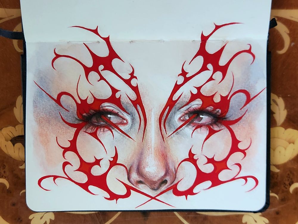 Small sketchbook painting of a woman's eyes and nose surrounded by graphic blood red liner. Her skin is painted in soft layers of peachy color, leaning towards blue around the eyes. Her dark eyes are looking up towards our left. The symmetrical red liner is composed of many swirls and spikes and almost looks like barbed wire. Two points of the liner are poking into the eyelids and jutting out of the pupils, casting a slight shadow on the skin
Painted in watercolor, gouache, and colored pencil