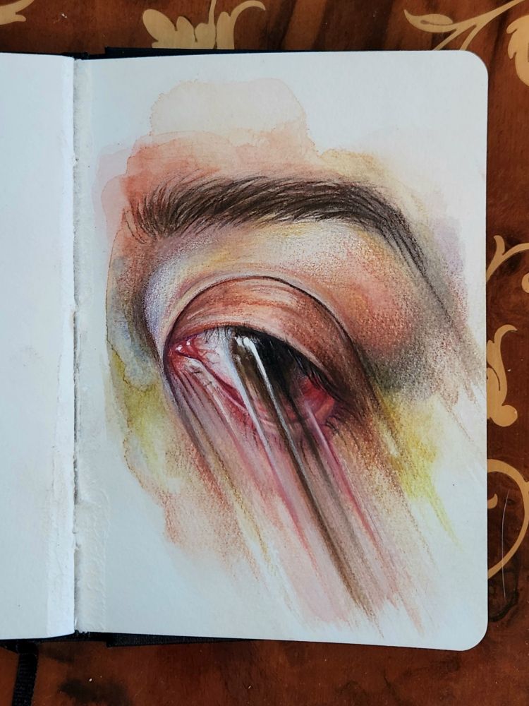 Small sketchbook painting of a very tired brown eye being smudged across the page. The skin is very warm and pink around the center, with pops of green and blue around the edges. The lower eyelid is being dragged down to show the fleshy interior, but the brown iris is smudged over it. The eyebrow is also lightly distorted. The smudges are directed in sharp, straight lines to the bottom right of the page
Painted in watercolor and colored pencil, with some gouache