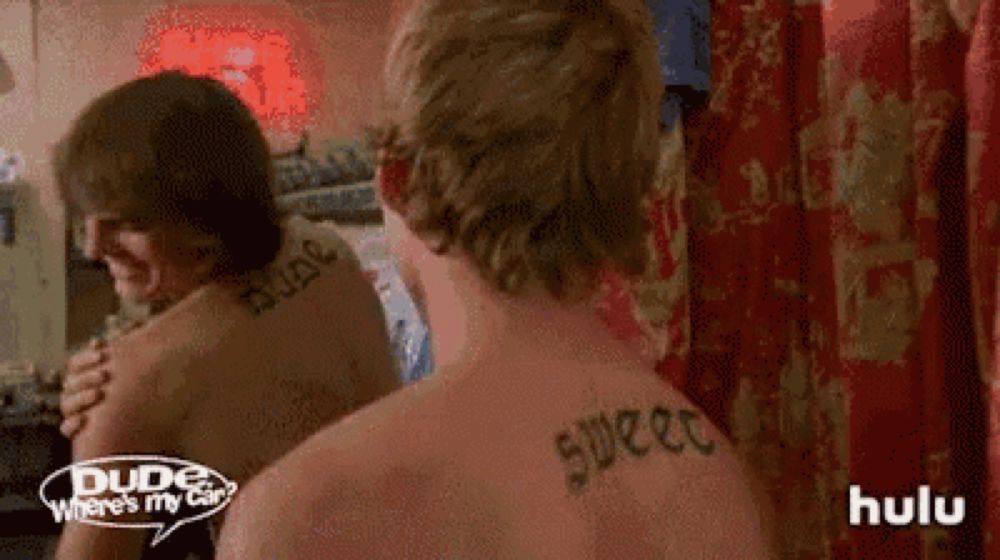 Scene from “dude where’s my car” where the two main characters have tattoos that say “dude” and “sweet” on their back and can’t figure out how to tell each other what they say