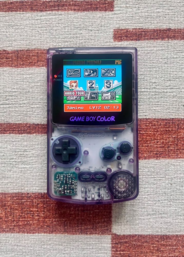 A Game Boy Color playing Mario Tennis