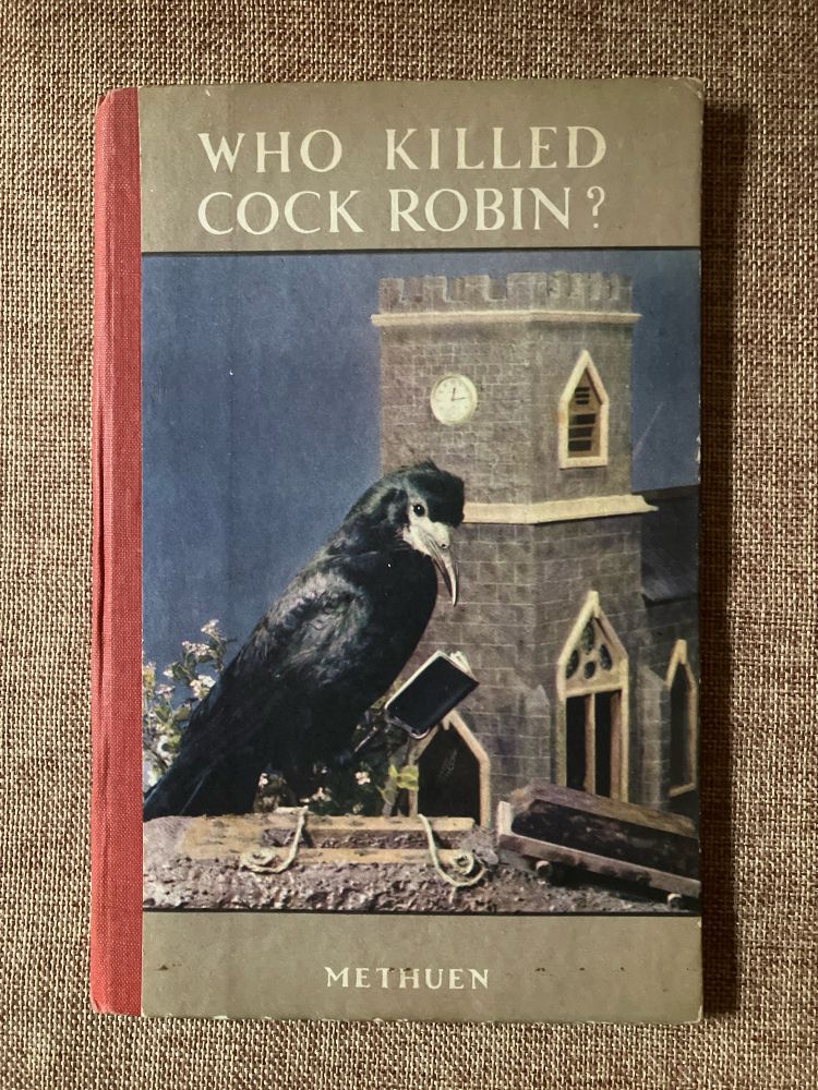 Cover of a picture book called Who Killed Cock Robin with a photograph of a stuffed crow 