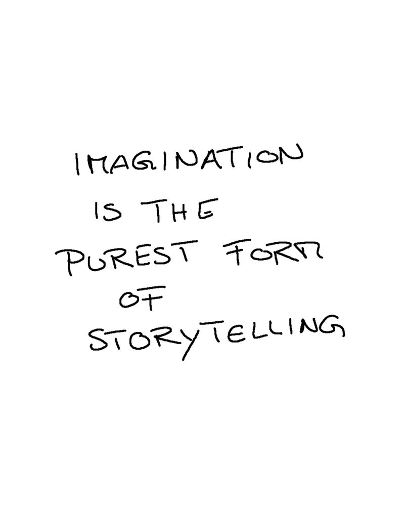 Black handwriting on white paper saying: Imagination is the purest form of storytelling 